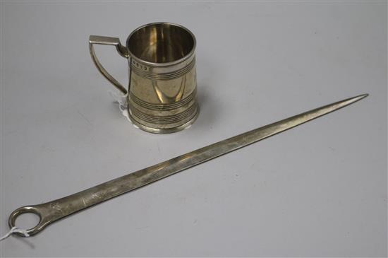 A George III silver meat skewer, London 1800 and a silver Christening mug of cylindrical reeded form, London 1805, John Emes